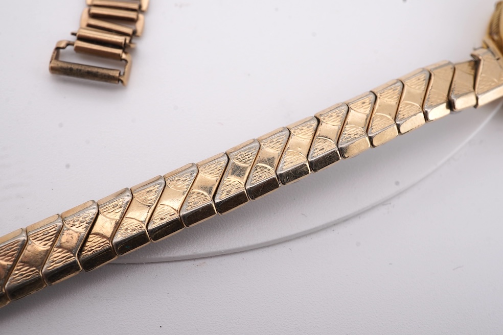 A lady's 1950's 9ct gold Tudor manual wind wrist watch, with Arabic dial, case diameter 18mm, on a damaged 9ct gold bracelet, gross weight 18.6 grams, together with a lady's 18ct gold Buren manual wind wrist watch, on a